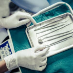 Dentists choose equipment on the table.